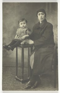 Untitled Postcard (Woman with Boy on Stand) by Unknown