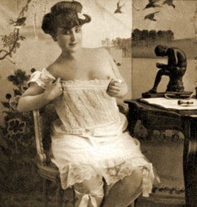 Young woman displaying a lacy chemise, c.1900 by Unknown