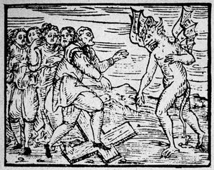 Witchcraft: the devil and the men walking on the Catholic cross - engraving by Unknown artist