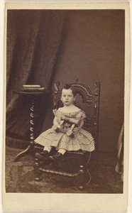 Unidentified Little Girl Holding a Toy Wooden Horse, Seated by Unknown artist