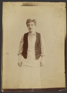 Man Wearing a Vest and Apron