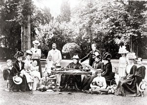 Members of the British Royal Family including King George V, King Edward VIII around Queen Victoria at a garden party