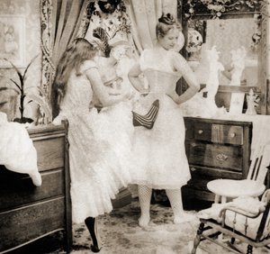 Reducing the Surplus, stereoscopic card depicting a young woman being laced into a corset, c.1900 by Vermont, USA H.C. White Company