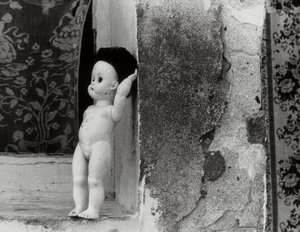 Doll on a Window Sill