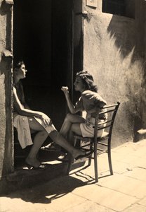 Two Girls Sitting on a Doorstep
