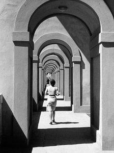 Young Woman Passing Under a Portico