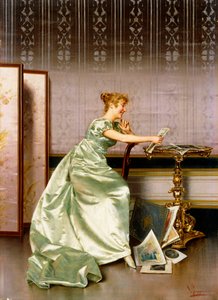 An Elegant Lady Admiring a Portfolio of Prints by Vittorio Reggianini