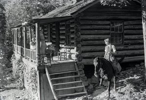 Woman, possible healthcare worker, on horseback visits with neighbors or family by Volkmar Wentzel