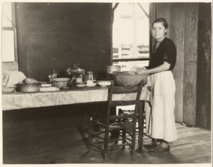 Elizabeth Tengle at the Kitchen Table / Paralee Ricketts Working in the Kitchen by Walker Evans
