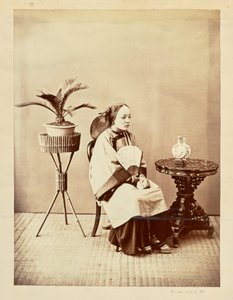 Studio Portrait of a Seated Young Woman Holding a Fan by William Saunders
