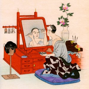 Traditional Japanese theater: an actor performs makeup in his dressing room