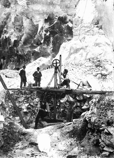 Some excavators at work in a marble quarry in the Apuan Alps, in Tuscany by A. Corsini