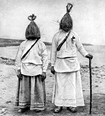 A pair of straw boys, Ireland, 1922 by A. W. Cutler