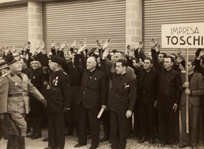 The construction workers of the Company Mauro Toschi fu Ulisse, salute the Duce Benito Mussolini during Inauguration of the buildings of the Royal Airport 
