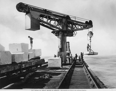 Loading blocks of marble with a hydraulic crane in Marina di Carrara by Fratelli Alinari