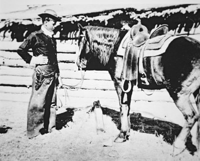 Butch Cassidy (1866-1908/09) with his horse by American Photographer