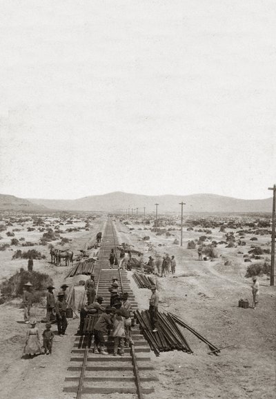 Construction in 1869 of the Central Pacific Railways - Nevada - Workers building the railway lines of the Central Pacific Company to build the first North American transcontinental railway by American Photographer