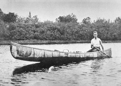 Franklin D. Roosevelt paddling a birch canoe at Campobello Island, New Brunswick by American Photographer