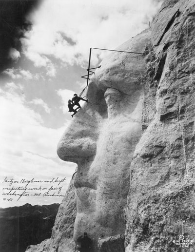 Gutzon Borglum inspecting work on Washington at Mount Rushmore, 1932 by American Photographer
