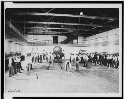 Male Native American students in physical education class, Carlisle Indian School, Pennsylvania, c.1901-03 (b/w photo) by American Photographer