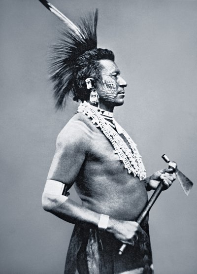 Osage Tribe Warrior with tomahawk pipe, c.1875 by American Photographer