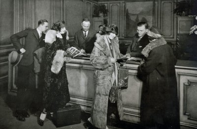 Passengers purchasing tickets at the ticket office of the Great Northern Railway, Chicago by American Photographer
