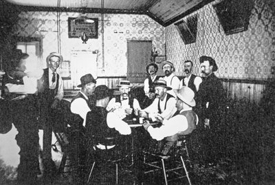 Playing cards in a Western saloon, c.1900 by American Photographer