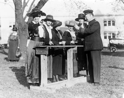 Police Officer Teaching Women How to Shoot, c.1920 by American Photographer
