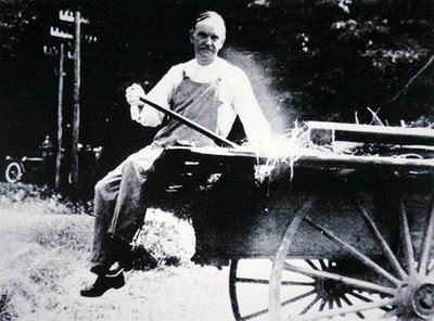 President Calvin Coolidge (1873-1933) posing as a farmer during a vacation in Vermont by American Photographer