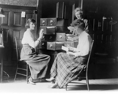 Three Women Work at the Card Index Files at the Headquarters of the National Woman