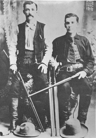 Wells Fargo stagecoach messengers armed with shotguns and Winchester repeating rifles by American Photographer