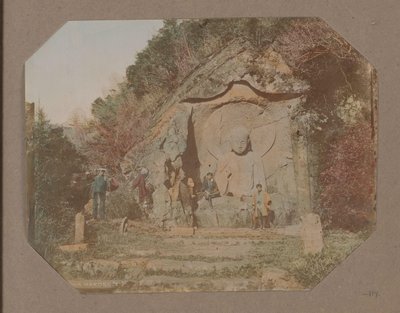 Three men by a relief with Buddha in Hakone, Japan by Anonymous