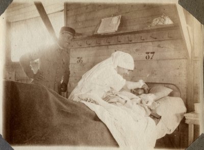 First World War 1914-1918: nurse shaving a soldier in Couville, Lower Normandy, France. Anonymous photograph July 1917. Private collection, Stella. by Anonymous Anonymous