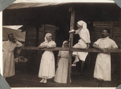 First World War 1914-1918: Nurses and Doctors in Blouse Talking in Couville, Manche, Lower Normandy, France. Anonymous Photograph July 1917. Private Collection, Stella. by Anonymous Anonymous