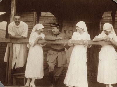 First World War 1914-1918: nurses and doctors talking with a French soldier in Couville, Lower Normandy, France. Anonymous photograph July 1917. Private collection, Stella. by Anonymous Anonymous