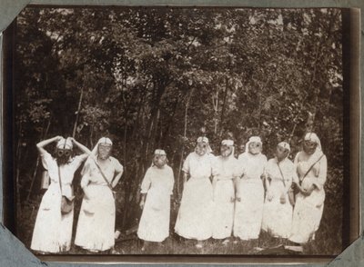 First World War 1914-1918: nurses wearing gas masks in the woods near Couville, Lower Normandy, France. Anonymous photography May 1917. Private collection, Stella. by Anonymous Anonymous