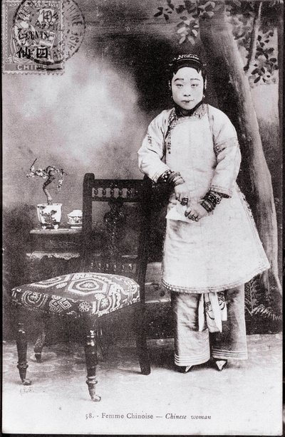 Portrait of a young Chinese woman in traditional costume. She has bound feet. Photography from the beginning of the 20th century. Private collection by Anonymous Anonymous