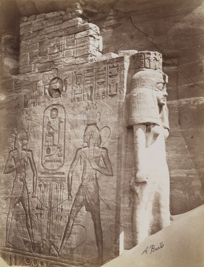 Queen at Temple of Abu Simbel, view of detail of throne and queen below the seated Colossus of Ramesses II at the north side of the entrance to the South Temple by Antonio Beato
