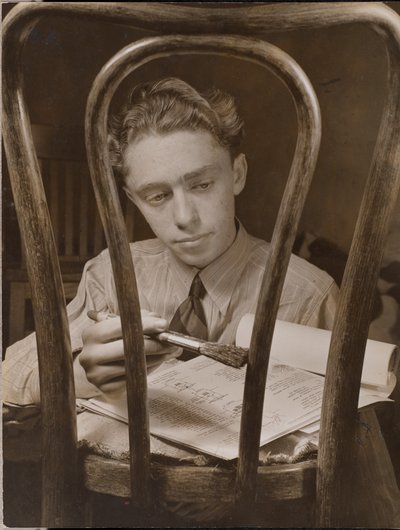 Young Man Paints the Back of a Wooden Chair by Arnold Eagle