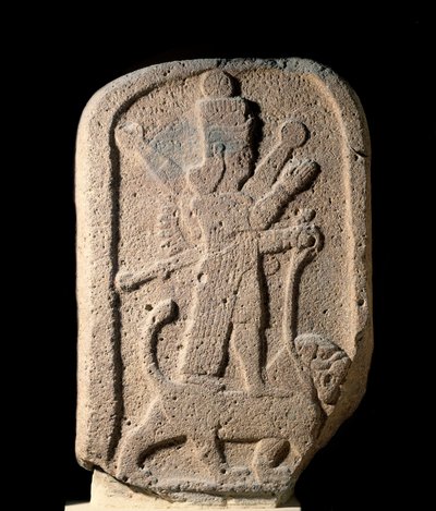 Stele representing the goddess Ishtar of Arbeles holding a lion by Assyrian