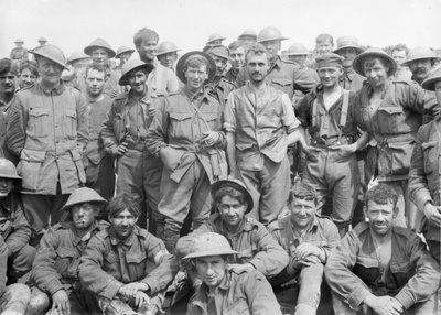 A group of the 46th Australian Infantry Battalion just after coming out of the line in front of Monument Wood, showing the condition of the by Australian Photographer