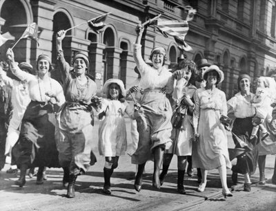 A Group of Women and Children Rejoicing in a Street in Sydney at the Signing of the Armistice, 11 November 1918 by Australian Photographer