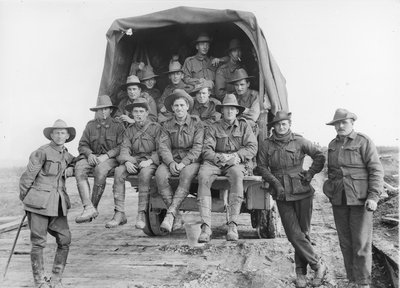 A lorry load of Australian Artillery reinforcements proceeding along the road to join the batteries of the 5th Australian Divisional Artillery, engaged in the battle for the Hindenburg Line Defences by Australian Photographer