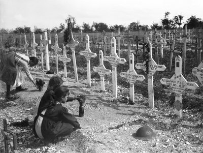 French children tending graves at Adelaide Cemetery of Australians killed in battle on the Western Front, Villers-Bretonneux, France 26 August 1919 by Australian Photographer