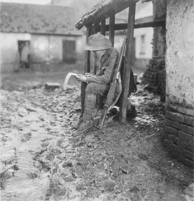 In Billets at Flesselles. A Member of the Australian 2nd Battalion Carrying on with His Correspondence, 17-30 November 1916 by Australian Photographer