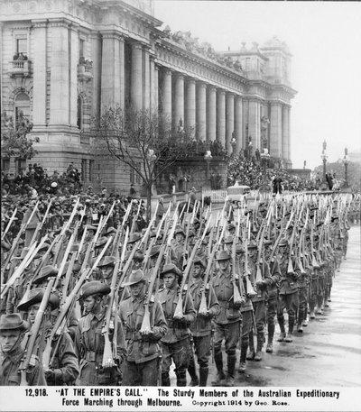 Men of the AIF marching past the Parliament House in Melbourne, their rifles with bayonets fixed, prior to embarkation for overseas service, c. August 1914 by Australian Photographer