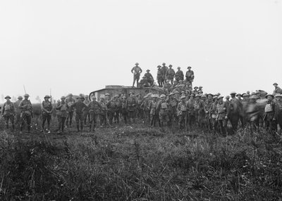 Outdoor group portrait of a tank crew and some members of the 5th Australian Infantry Brigade, 8 August 1918 by Australian Photographer