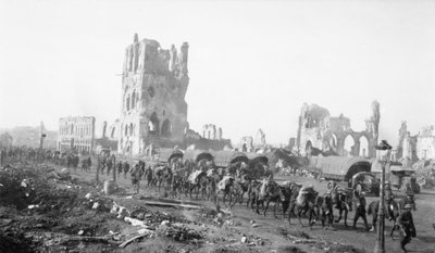 Ypres, Belgium. 18 October 1917. Pack mules taking up supplies with the Infantry. Note the shell damaged buildings in the background, 18 October 1917 by Australian Photographer