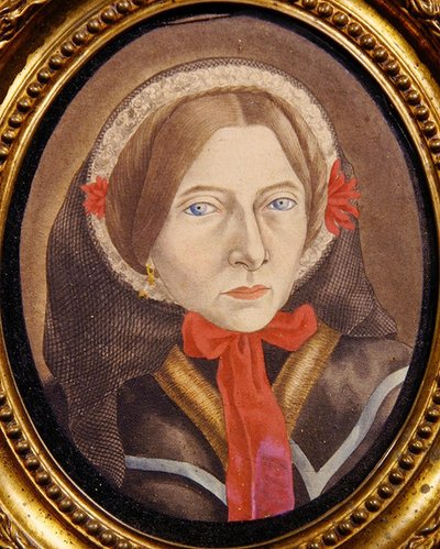 Portrait of a woman with a bonnet and red ribbon by Austrian School