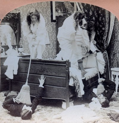 USA: gender scene, young girls repel visitors with brooms, caches under bed by Benjamin West Kilburn